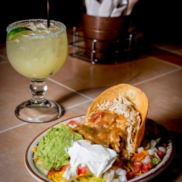 A Moose Hill Cantina chicken taco salad with guacamole, sour cream, and a margarita.